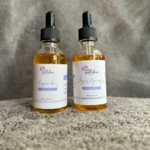 two bottles of facial serum liquid on a surface