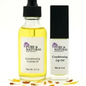 Pure & Natural Body Essentials Conditioning Cuticle Oil and Conditioning Lip Oil set displayed together on a clean white background with soft natural lighting. Minimalist spa-inspired product photography showcasing vegan, handcrafted skincare made in Michigan.”