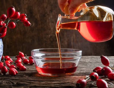 Pouring rose hip seed oil into a bowl -