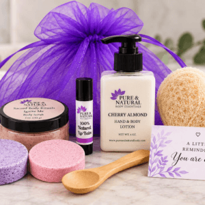 Self care gift set with body scrub, two shower steamers, hand and body lotion, unscented lip balm, heart-shaped loofah, wooden spoon and affirmation card
