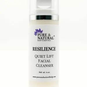 A clear cylindrical bottle of Pure & Natural Body Essentials Resilience Quiet Lift Facial Cleanser, displayed upright against a white background with a clean label and airless pump.