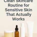 Flat lay of natural skincare products on a light background with green leaves and soft shadows, representing a clean skincare routine for sensitive skin.