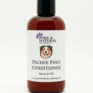 Amber bottle of Pachee Paws Natural Dog Conditioner by Pure & Natural Body Essentials on white background.