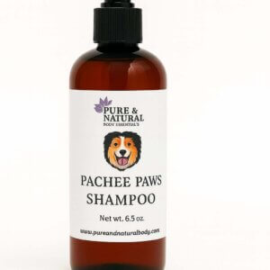 Amber bottle of Pachee Paws Natural Dog Shampoo by Pure & Natural Body Essentials on white background.